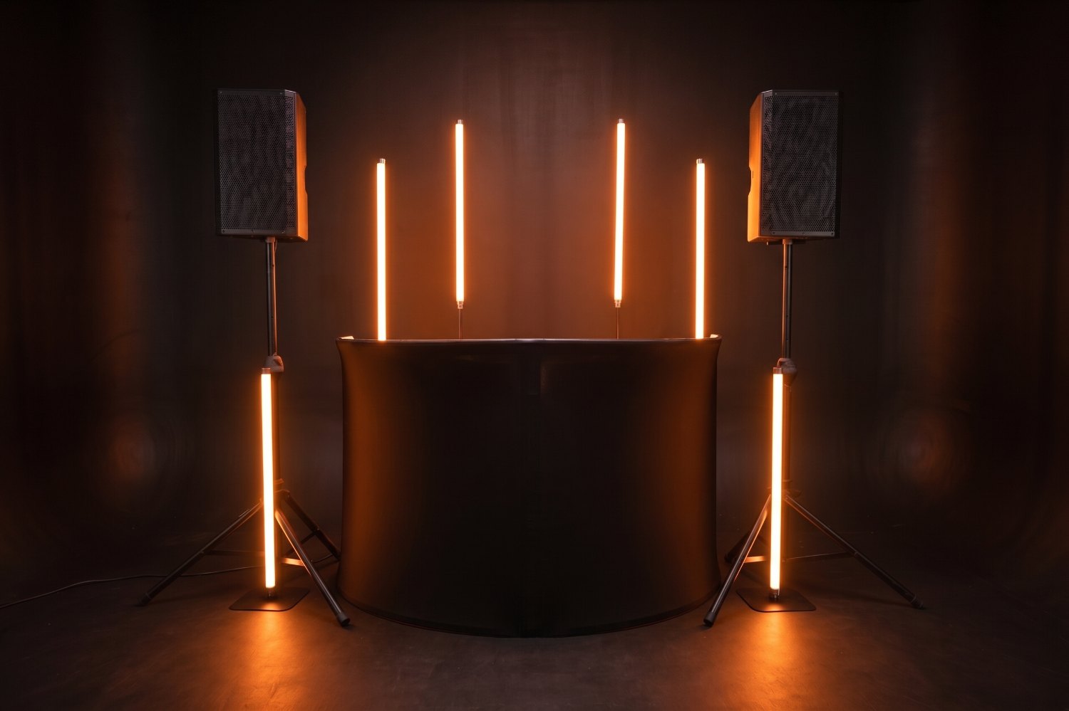 The Glow Up tubes framing the booth